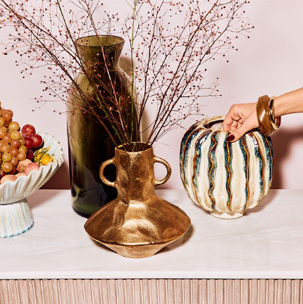 Stylish, textured vases in different styles & faux florals.