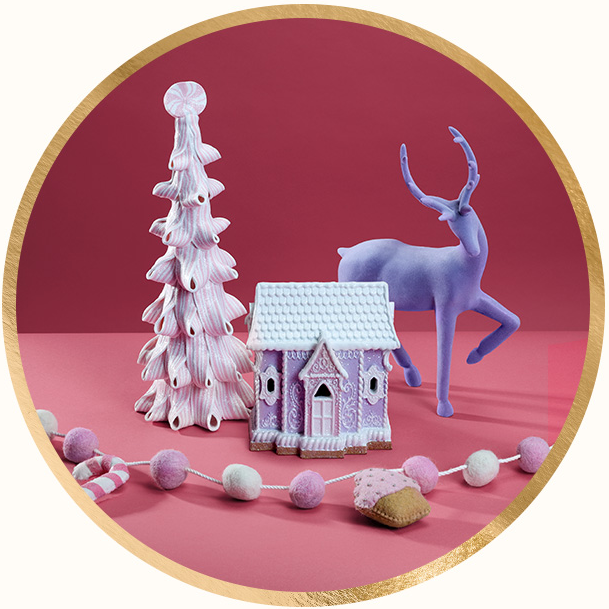 Peppermint Christmas tree figurine, sparkly gingerbread house and pastel reindeer décor.